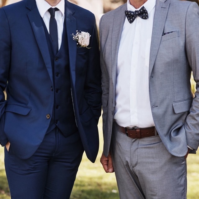 Navy three-piece suit and light grey suit with bow ties